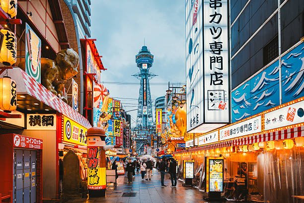 Color signs and Tsutenkaku Tower in Osaka
